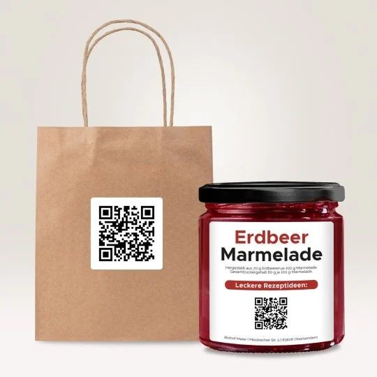 Slika prikazuje kartonasto vrečko z ročajem na katero je prilepljena etiketa s QR kodo.