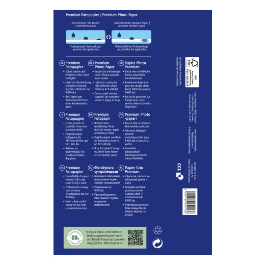 Slika prikazuje embalažo za premium fotografski papir, ki podrobno opisuje njegove značilnosti in prednosti v več jezikih. Poudarja hitro sušenje, možnost tiskanja z visoko ločljivostjo in informacije za podporo strankam.