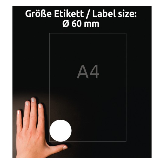 Slika prikazuje roko, položeno na temno površino poleg lista velikosti A4 z okroglo nalepko, označeno s premerom Ø 60 mm.