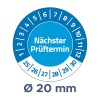 Slika prikazuje krožno kalibracijsko ali urniško kolo s številkami od 1 do 12 in delom za datume od 25 do 30, označeno z 'Nächster Prüftermin' ter s premerom 20 mm.